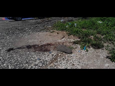 Credit: Corey Robinson Area along Rusden Road in Kingston where police say a suspect in the Rockfort Heroes Day shooting was killed in a confrontation with them.