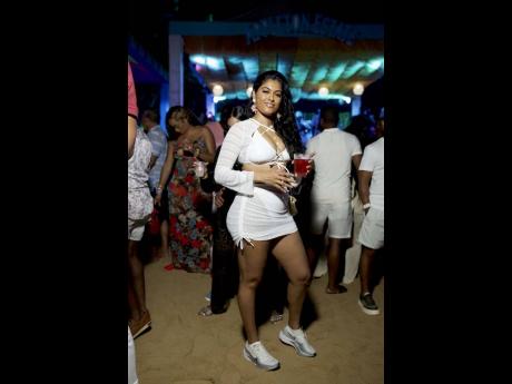 Credit: Contributed Moonmattie Seitaram, attorney-at-law, dazzled in full white, making a statement as she soaked up the party vibes.