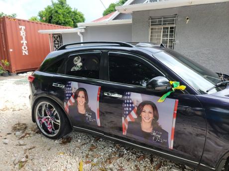 Girma Dickens’ car decked out with posters of Kamala Harris.