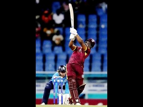 Credit: AP West Indies opener Evin Lewis hits a delivery from England’s Adil Rashid (not in photo) for six during the first one-day-international at Sir Vivian Richards Ground in North Sound, Antigua and Barbuda. Lewis is one of the players coach Daren Sammy hopes will come good in the remaining T20 International series.