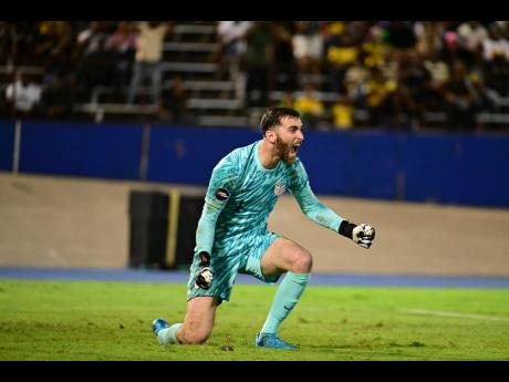 United States goalkeeper Matt Turner celebrates after palming away Demarai Gray’s penalty during the Concacaf Nations League quarter-final football game against Jamaica at the National Stadium on Thursday night.