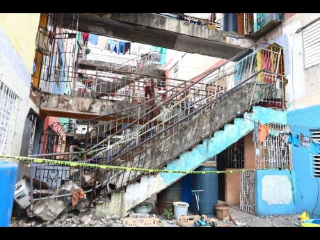 The collapsed staircase at the apartment building in Torrington Park, St Andrew.