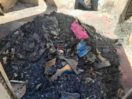 Credit: Simone Morgan-Lindo Rubble is all that's left of residents' belongings.