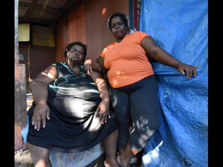 Credit: Ian Allen Beverley Anderson (left) with her daughter, Jody-Ann Jackson, share their heartbreaking story of life in Salt Lane, St Thomas.