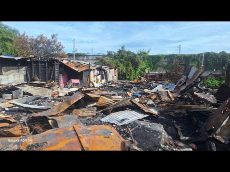 Credit: Simone Morgan-Lindo Photos The section of Majesty Gardens known as ‘Board Building’ that was severely impacted by Saturday’s fire.