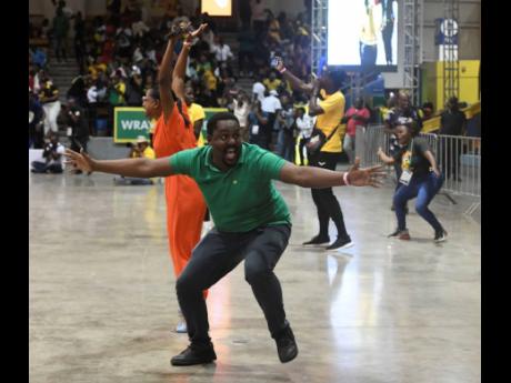 Credit: Antoine Lodge Joyous fans celebrating the Sunshine Girls’ narrow 50-49 victory against the Vitality Roses in Game Three of the Horizon Netball Series between Jamaica and England at the National Indoor Sports Centre last night.