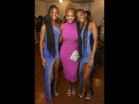 The HoSang Twins Kyla (left) and Kayla (right) with their big sister and manager Santana, at the launch of Sting 2024 held in New Kingston on Tuesday.