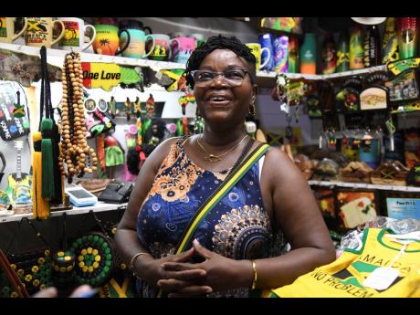 Credit: Antoine Lodge Popular Kingston Craft Market vendor Aunty Joan has an assortment of souvenirs.