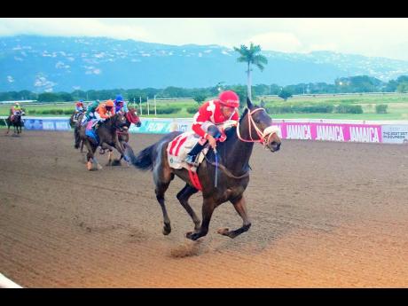 Credit: Anthony Minott UNBELIEVABLE FORCE, ridden by Raddesh Roman, winning the Charles Hussey OD Trophy over five furlongs straight at Caymanas Park yesterday. The event was a three-year-old and over Restricted Allowance Stakes.