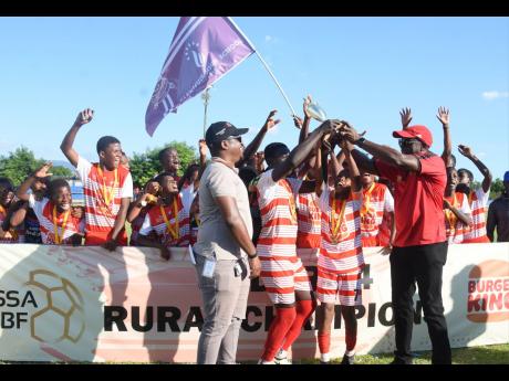 Credit: Ashley Anguin Photos Glenmuir High School celebrate winning the 2024 ISSA/Burger King rural under-14 football title at St Elizabeth Technical High School yesterday. Glenmuir defeated Manchester High 1-0.