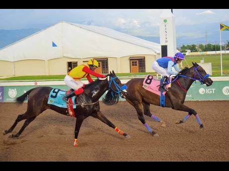 ACKNOWLEDGEME (right), ridden by Dick Cardenas, winning the MASTER BLASTER Trophy ahead of FLYBLUEJET (Javaniel Patterson) over five furlongs straight at Caymanas Park on Sunday.