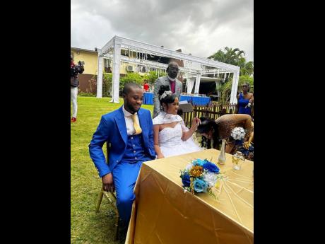 Credit: Contributed The happy couple take a seat for the reception.