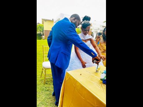 Credit: Contributed The couple pour sand as a representation of their union.