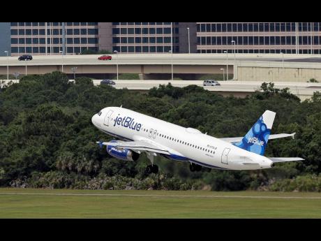 Credit: Chris O'Meara FILE - A JetBlue Airways Airbus A320-232 takes off from the Tampa International Airport in Tampa, Fla., May 15, 2014 (AP Photo/Chris O'Meara, File)
