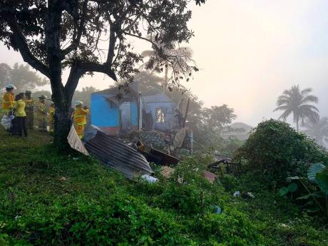 Credit: Contributed The house in which three children perished in Walkerswood, St Ann, yesterday.