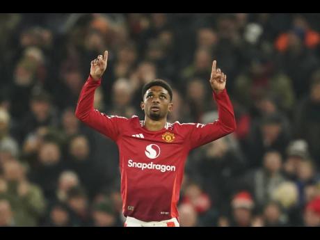 Credit: AP Manchester United’s Amad Diallo celebrates after scoring his team’s first goal during their English Premier League soccer match against Southampton at Old Trafford Stadium in Manchester yesterday. Manchester United won 3-1 with Diallo scoring all three goals.