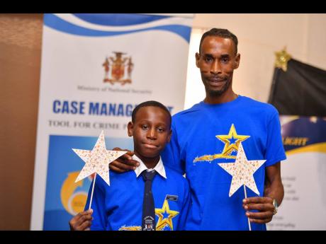 Credit: Contributed Leroy Forbes (right) and his 10-year-old son, Jaylee Forbes, who participated in the Ministry of National Security’s Case Management Strategy Programme.