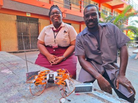 Herbert Morrison Technical High’s Kayla Hewan (left) and her mechanical engineering teacher, Kevin Coke. 