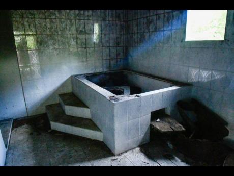 Credit: Matthew McKoy The base of the jacuzzi tub near the master bedroom has deteriorated.