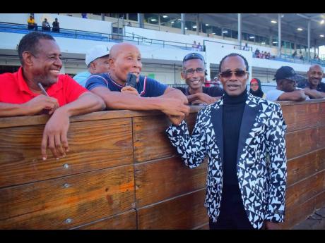 Legendary rider Trevor ‘Slicer’ Simpson is greeted by turfites at Caymanas Park, where he was on hand to witness the race named in his honour, The Trevor ‘Slicer’ Simpson OD Trophy, which was run over five furlongs round at Caymanas Park on Saturday. CALIFORNIA CROWN, ridden by Robert Halledeen, won the event.
