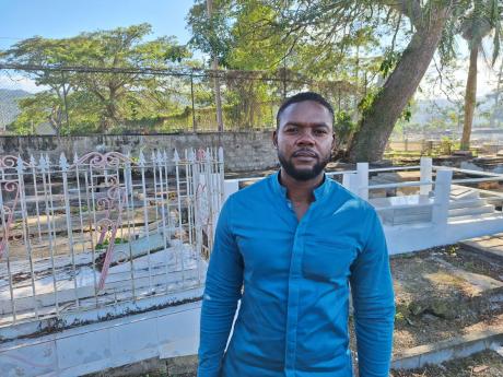 Credit: Rochelle Clayton Mayor of Montego Bay Richard Vernon at the Pye River Cemetery in St James