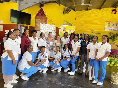 Credit: Tiffany Pryce Nursing students from Trench Town Polytechnic College along with their principal and vice principal pose for a photo with lecturers and nursing students from College of the Rockies in Canada.