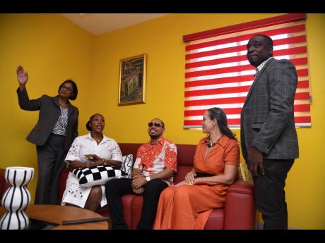Credit: Antoine Lodge From left: Dr Susan Wright, acting regional technical director in the Ministry of Health and Wellness; Suzette Buchanan, CEO at Bellevue Hospital; Ramone Baxter, manager for Reggae Boy Leon Bailey; Dr Diana Thorburn, chairman of the hospital’s board of management; and Dr Roger Roberts, senior medical officer at the hospital; engage in a conversation while sitting in the hospital’s newly launched family room during its launch on Monday.