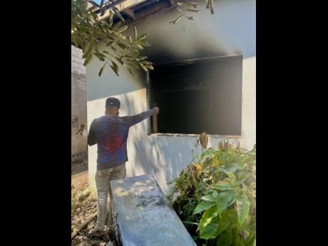 Credit: Ashanti Lawson Neighbour Jerry Smith showing what’s left of the dwelling.
