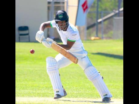 Credit: Lennox Aldred Clarendon Cricket Association opening batsman Randre Christie on the go during his 102 against St Catherine CA in the opening round of the Michael Holding Senior Cup at the Jamalco Sports Club last Saturday.