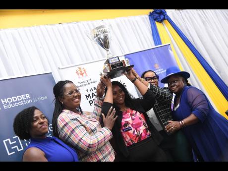 Credit: Antoine Lodge Photos Shanique Pryce (centre), the 2024 Mathematics Teacher of the Year, celebrates with (from left) Rivaley Patterson, senior education consultant at Hachette Learning; Terry-Ann Thomas-Gayle, acting chief education officer in the Education Ministry; Dr Kasan Troupe, permanent secretary in the ministry; and Dr Lorna Thompson, national mathematics coordinator.