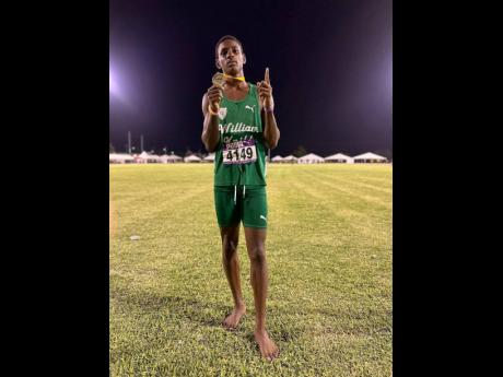 Credit: Contributed William Knibb Memorial High’s Sanjay Seymore poses with his medal after a track meet.