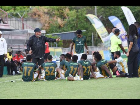 Credit: Ian Allen Ian Allen/Photographer
Craig Butler (left), technical director of Vere Phoenix United FC, gives half time instructions to the team against Molynes FC in their Jamaica Premier League football match at Anthony Spaulding Sports Complex on Wednesday.