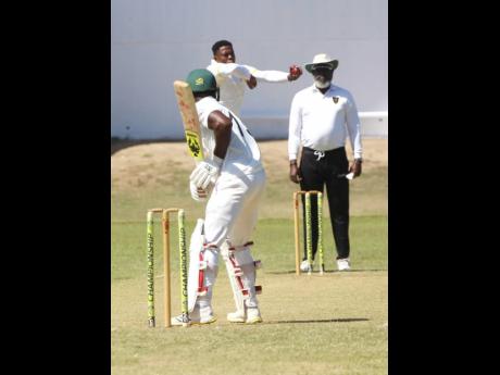 Kingston Cricket Club’s batsman Romaine Morris gets ready to face a delivery from Jamaica Defence Force fast bowler Sheldon Cottrell during their Jamaica Cricket Association Michael Holding Senior Cup cricket match at Sabina Park.