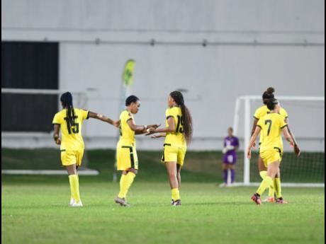 Jamaica’s Reggae Girlz celebrating a goal in a recent friendly international.