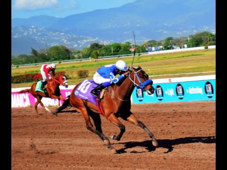 Credit: Anthony Minott I’M Outstanding (foreground), ridden by Reyan Lewis, winning the sixth race over five furlongs at Caymanas Park on Saturday, April 5.
