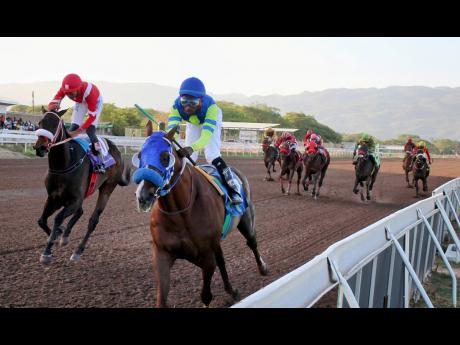 MAHOGANY (second left), ridden by Tajay Soocko, wins Easter Sprint Cup ahead of UNBELIEVABLE FORCE (Raddesh Roman), over 5 1/2 furlongs at Caymanas Park on Monday.