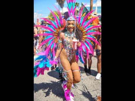 Credit: Matthew McKoy Influencer Sham dons a MEZARA outfit on the Gen XS Carnival Band march.