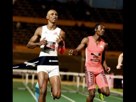 Credit: Ian Allen Brazil’s Alison dos Santos (left) winning the men’s 400m hurdles ahead of Jamaica’s Roshawn Clarke at Grand Slam Track’s debut meeting at the National Stadium in Kingston last month.