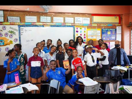 Credit: Contributed Volunteers take a pic with students of Kingsway High and Preparatory School.