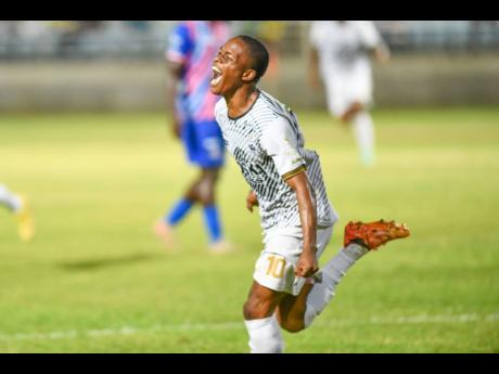 Credit: Matthew McKoy Dwayne Atkinson of Cavalier FC celebrates the goal of the match during their Jamaica Premier League quarter-final football match against Portmore United at Sabina Park on Monday.