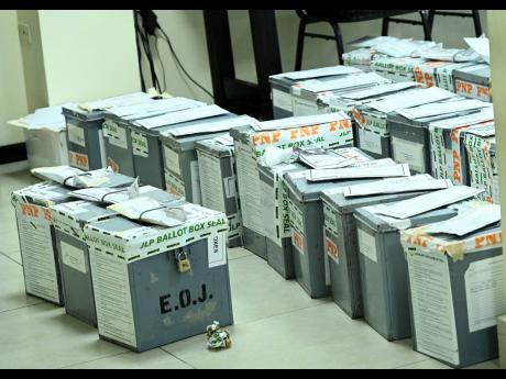 Credit: File Ballot boxes await counting following the close of polls.