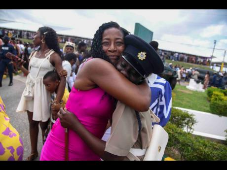Credit: Antoine Lodge Photos Onisha Bramwell (right) is embraced by her stepmother, Jacqueline Thomas, at the passing-out parade of the Jamaica National Service Corps Intake 2024/01 at Up Park Camp last Thursday.