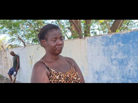 Credit: Almando Smith Prudence Griffiths, mother of missing boy Navardo Blackburn, cries as she yearns to see her son again.