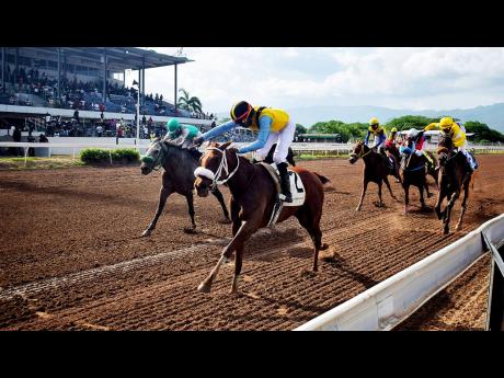 Credit: Anthony Minott QUEEN OF SOUL, ridden by Omar Walker, winning the sixth race running at odds of 10-1 over 5 1/2 furlongs at Caymanas Park on Saturday, May 10.
