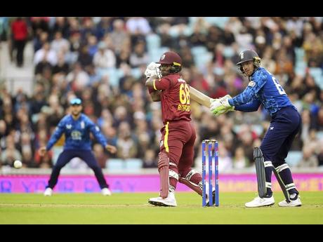 West Indies’ Sherfane Rutherford bats during the third one-day international cricket match against England at The Oval in London, England, yesterday.
