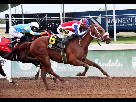 SENSATIONAL SOUL (right), ridden by Shane Ellis, wins the 51st running of the 2000 Guineas, a grade one stakes ahead of BOB THE BUILDER (Raddesh Roman) at Caymanas Park yesterday.