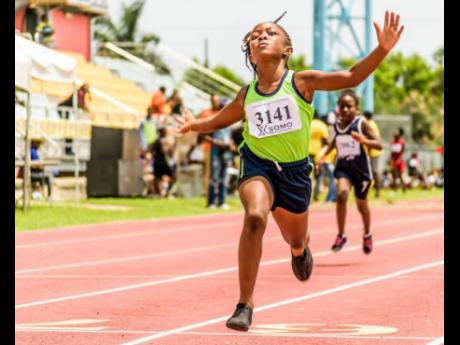 Credit: Contributed A student winning an event during the Western Primary Schools Athletics Championships at the Montego Bay Sports Complex in 2016.
