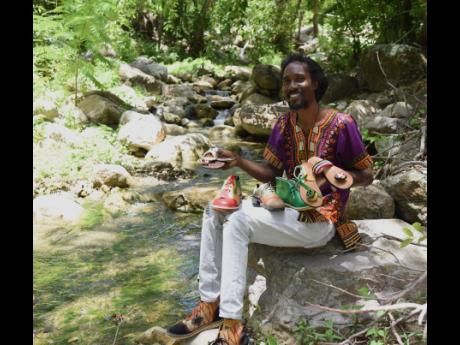 Credit: Ian Allen Bonner shows off some of his shoes.