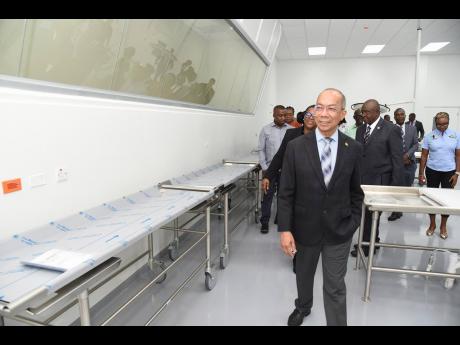 Credit: Ian Allen Deputy Prime Minister and Minister of National Security Dr Horace Chang tours the Forensic Pathology Autopsy Suite in Kingston.