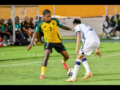Credit: Matthew McKoy Leon Bailey (left) of Jamaica goes on the attack against Carlos Aguilar (right) of Guatemala during a World Cup Qualifier between Jamaica and Guatemala at the National Stadium on June 10, 2025.
